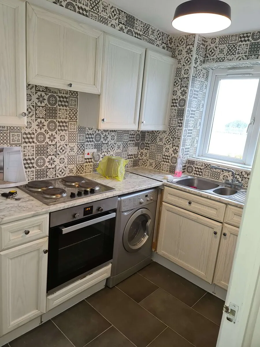 Completed kitchen refit with new units, hob and oven in East London