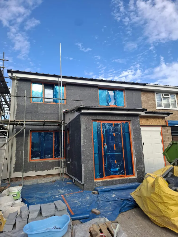 Graphite EPS insulation boards installed on a London home before rendering