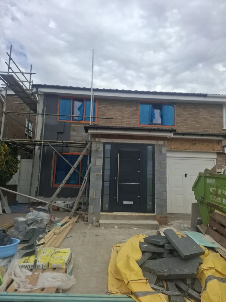 Fixing external wall insulation boards to a London house